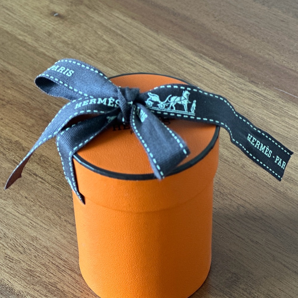Hermès Vibrant Orange Gift Box with Elegant Black Ribbon